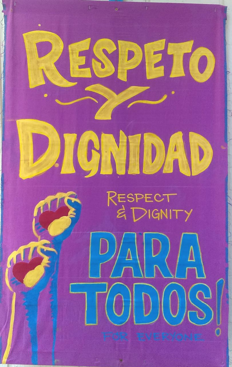 Spanish Language Immigrant Rights sign created with local immigrant community